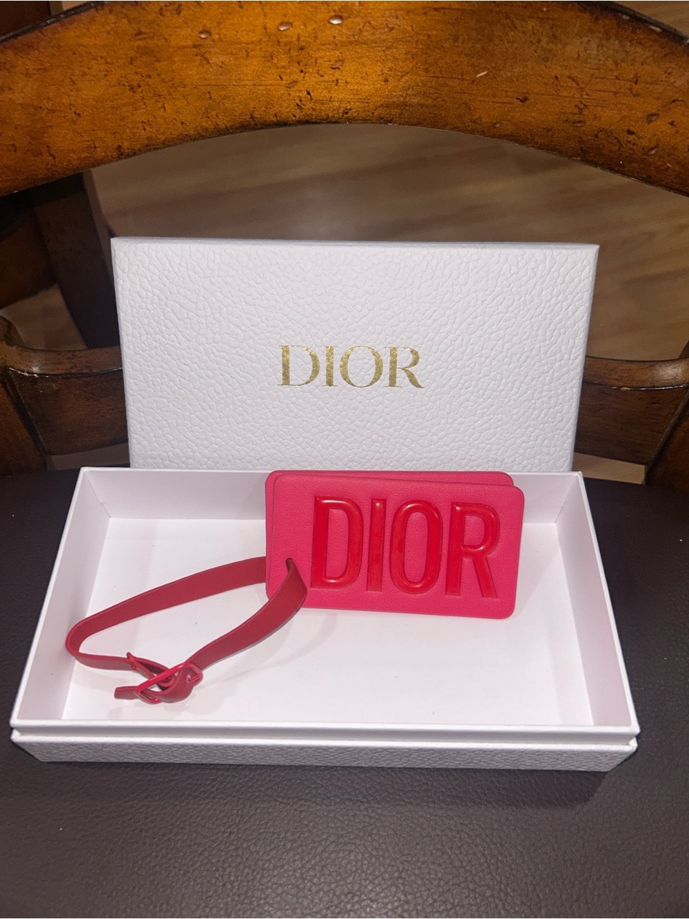 DIOR Red Embossed Luggage Tag. NWOT. DOES NOT come with box.
